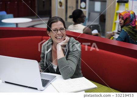 Woman working on laptop networking technology Woman working on laptop networking technology 33219453