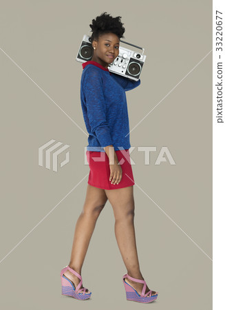 African Descent Woman Holding Jukebox African Descent Woman Holding Jukebox 33220677