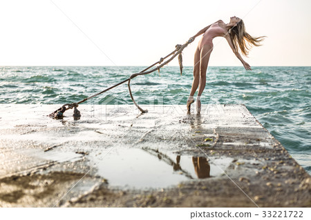 Ballerina posing on seafront Ballerina posing on seafront 33221722