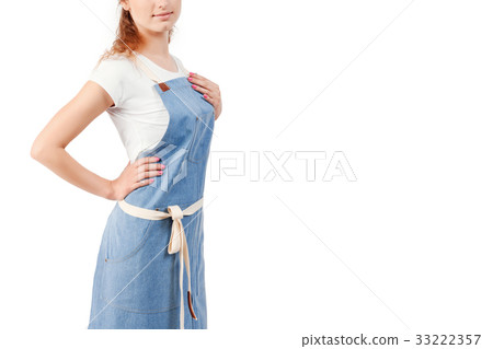 Young redhaired woman chef or waiter posing Young redhaired woman chef or waiter posing 33222357