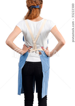 Young redhaired woman chef or waiter posing Young redhaired woman chef or waiter posing 33222380