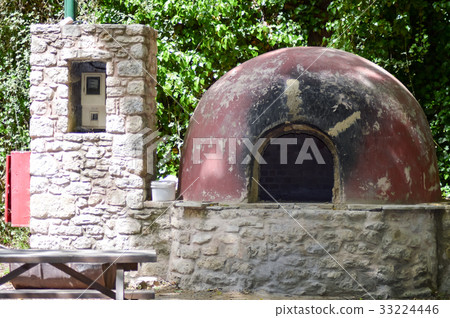 Outdoor pizza oven in an undergrowth 33224446