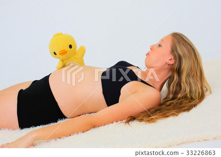 Stuffed toy and pregnant woman Stuffed toy and pregnant woman 33226863