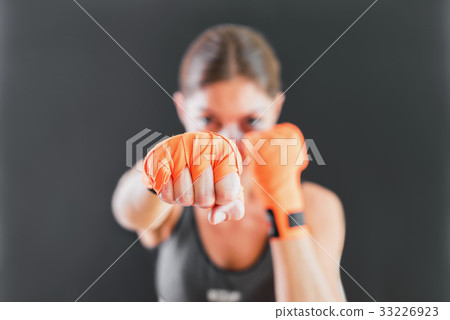 Power Female Punching With Boxing Bandage Power Female Punching With Boxing Bandage 33226923