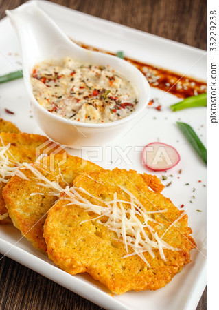 Potato pancake with sauce Potato pancake with sauce 33229238