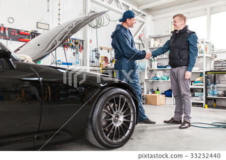 Sports car in a workshop Sports car in a workshop 33232440