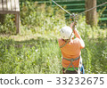 Boy climbs a tree 33232675