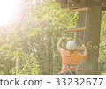 Boy climbs a tree 33232677