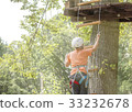 Boy climbs a tree 33232678