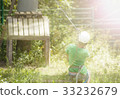 Boy climbs a tree 33232679