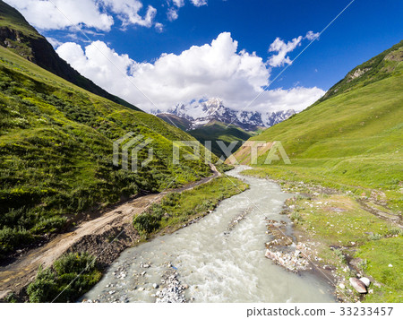 AERIAL.: River in mountain valley at the foot of AERIAL.: River in mountain valley at the foot of 33233457
