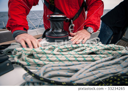 Hands sailor braid rigging ropes on a yacht 33234265