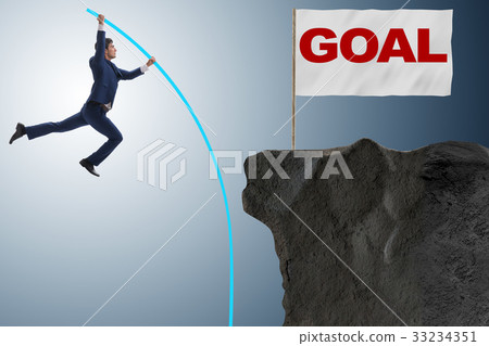 Businessman pole vaulting towards his success goal 33234351