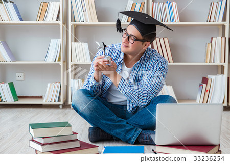 Young student studying with books Young student studying with books 33236254