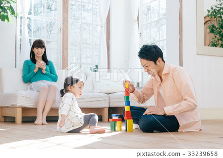 Family relaxing in the living room Family relaxing in the living room 33239658