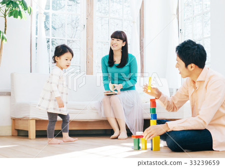 Family relaxing in the living room Family relaxing in the living room 33239659