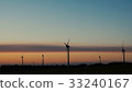 Wind turbines farms with rays of light at sunset 33240167