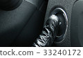 Macro engine start and stop button of a car. 33240172