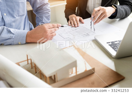 Person's engineer Hand Drawing Plan On Blue Print with architec Person's engineer Hand Drawing Plan On Blue Print with architec 33241253