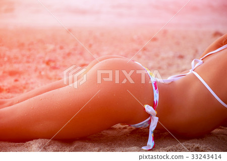 Sporty young beautiful woman in bikini. Toned Sporty young beautiful woman in bikini. Toned 33243414