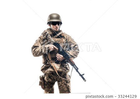 Armed serviceman in uniform 33244129