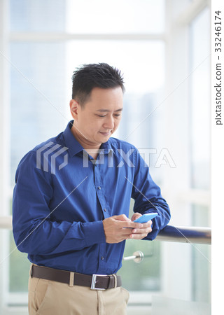 Texting business executive Texting business executive 33246174