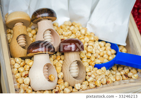 Hazel nuts with wooden nutcracker 33246213
