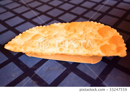 Chebureki or fried pie with meat close up 33247559