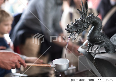 etal dragon spewing water at Senso-ji temple 33247929