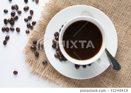 Cup of coffee and milk with biscuit on sackcloth Cup of coffee and milk with biscuit on sackcloth 33249419