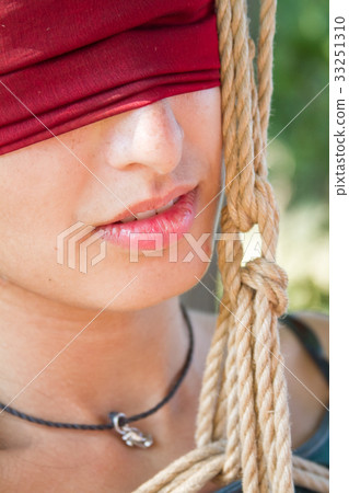 Shibari in nature in summer. Bound young girl. 33251310