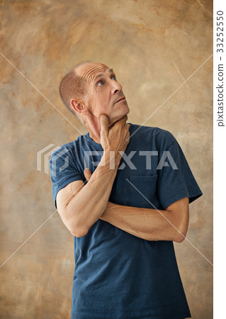 Worried mature man touching his head. 33252550