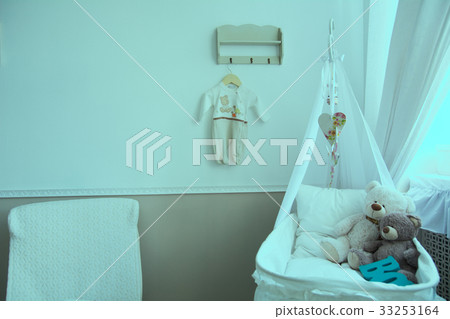 Interior of a nursery with a crib for a baby Interior of a nursery with a crib for a baby 33253164