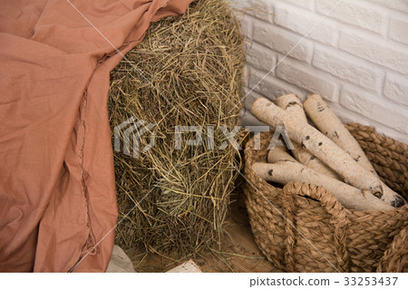 Hay and birch firewood in a room 33253437