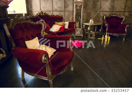 Beautiful antique room with red armchairs 33253457