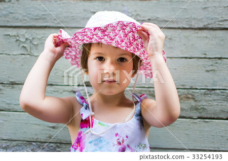 Cute 3 years old girl against vintage backdrop 33254193