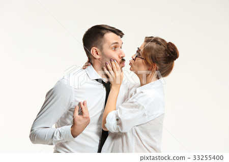 The business man and woman communicating on a gray 33255400