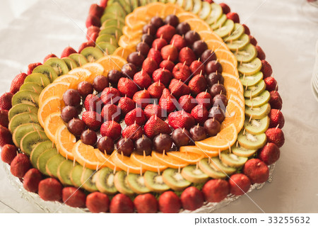 Various sweet sliced fruit on a buffet table 33255632