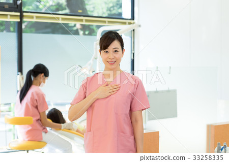 Career woman, dentist, dentist, dental hygienist, hands on chest Career woman, dentist, dentist, dental hygienist, hands on chest 33258335