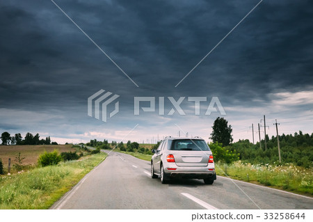 Gray Luxury SUV Car On Country Road At Summer 33258644