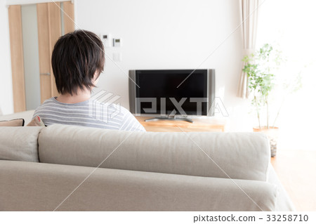 Men watching TV in the living room 33258710