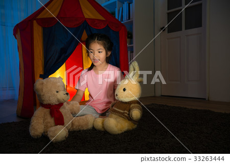 happy pretty child playing game with teddy bear 33263444