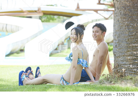Couple resting in the pool shade Couple resting in the pool shade 33266976