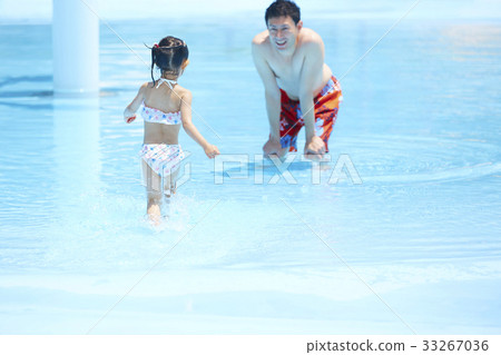 Parent and child playing in the pool Parent and child playing in the pool 33267036