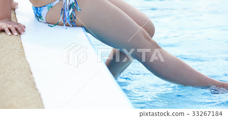 Poolside woman beautiful legs Poolside woman beautiful legs 33267184