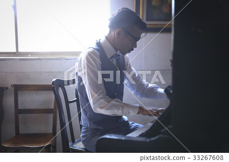 Men playing an instrument 33267608