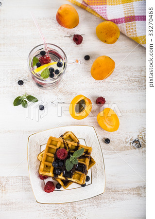 Belgian waffles with raspberries  33270468