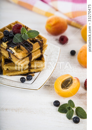 Belgian waffles with raspberries  33270475