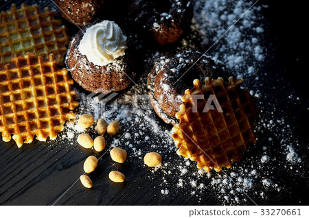 Lush fresh chocolate muffins sprinkled with 33270661