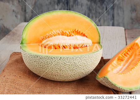 Melon cut on wooden. 33272441